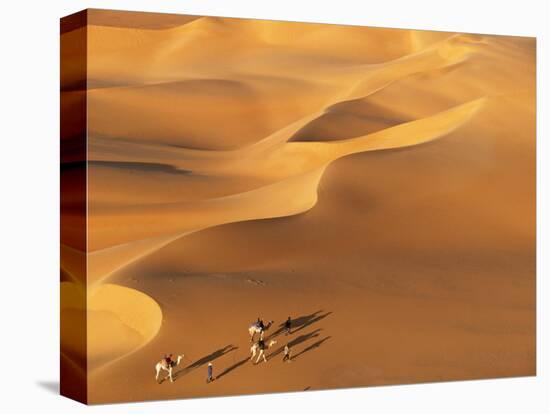 Tenere Desert, Camel Caravan Travelling Through the Air Mountains and Tenere Desert, Niger-Paul Harris-Stretched Canvas