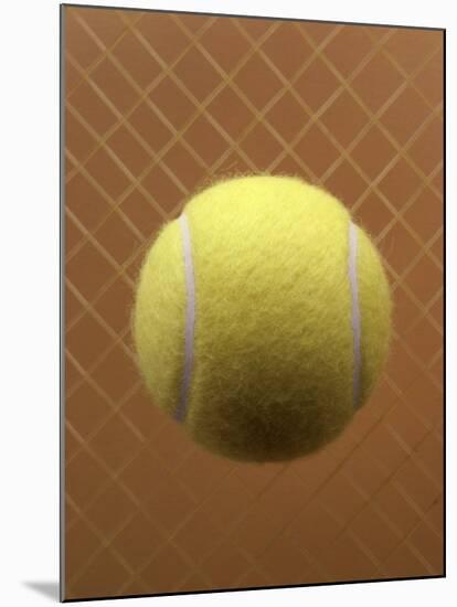 Tennis Ball Against a Racquet-null-Mounted Photographic Print