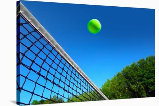 Tennis Ball on Net's Edge-mikdam-Stretched Canvas