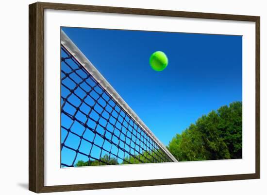 Tennis Ball on Net's Edge-mikdam-Framed Photographic Print