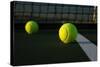 Tennis Balls on the Court close up with the Net Beyond-33ft-Stretched Canvas