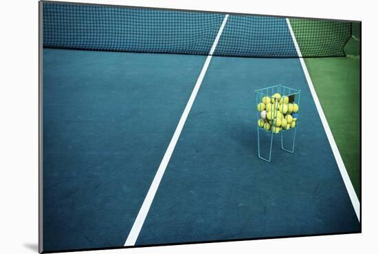 Tennis Court with Tennis Balls in Tennis Ball Basket Stand. Intentionally Shot in Surreal Tone.-optimarc-Mounted Photographic Print