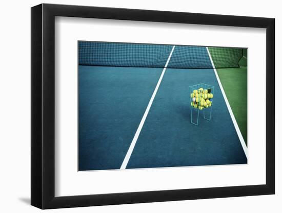 Tennis Court with Tennis Balls in Tennis Ball Basket Stand. Intentionally Shot in Surreal Tone.-optimarc-Framed Photographic Print
