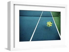 Tennis Court with Tennis Balls in Tennis Ball Basket Stand. Intentionally Shot in Surreal Tone.-optimarc-Framed Photographic Print