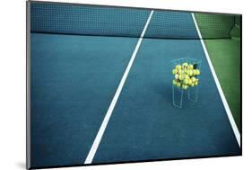 Tennis Court with Tennis Balls in Tennis Ball Basket Stand. Intentionally Shot in Surreal Tone.-optimarc-Mounted Photographic Print