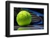Tennis Racquet Resting on Top of a Tennis Ball-Flynt-Framed Photographic Print