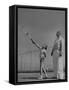 Tennis Teacher Wilbur Folsom Watching the Service of Young Anne Perkins-Allan Grant-Framed Stretched Canvas