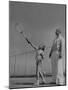 Tennis Teacher Wilbur Folsom Watching the Service of Young Anne Perkins-Allan Grant-Mounted Photographic Print