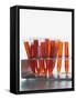 Test tubes filled with orange liquid-Kristopher Grunert-Framed Stretched Canvas