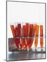 Test tubes filled with orange liquid-Kristopher Grunert-Mounted Photographic Print