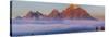 Teton Range mountains behind fog at sunrise, Grand Teton National Park, Wyoming, USA-Panoramic Images-Stretched Canvas