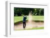 Thai Young Man Golf Player in Action Swing in Sand Pit during Practice before Golf Tournament at Go-Kitzero-Framed Photographic Print