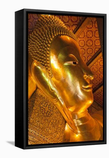 Thailand, Bangkok. Close-up of the head of the Reclining Buddha inside Wat Pho.-Brenda Tharp-Framed Stretched Canvas