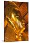 Thailand, Bangkok. Close-up of the head of the Reclining Buddha inside Wat Pho.-Brenda Tharp-Stretched Canvas