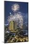 Thailand, Bangkok. Riverside, high angle skyline view with fireworks at dusk.-Walter Bibikow-Mounted Photographic Print