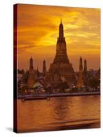 Thailand, Bangkok, Wat Arun ,Temple of the Dawn and Chao Phraya River Illuminated at Sunset-Gavin Hellier-Stretched Canvas