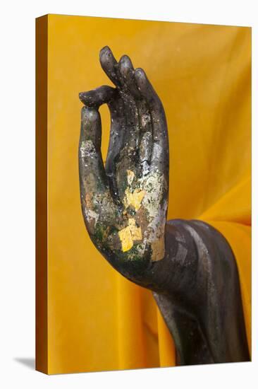 Thailand. Buddha Statue hand with gold leaf tokens.-Brenda Tharp-Stretched Canvas