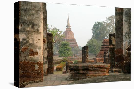 Thailand, Sukhothai. Wat Mahathat Chedi at Sukhothai Historic Park-Kevin Oke-Stretched Canvas