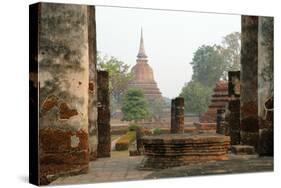 Thailand, Sukhothai. Wat Mahathat Chedi at Sukhothai Historic Park-Kevin Oke-Stretched Canvas