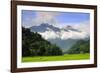 Thatched cottages and rice paddy fields with misty mountains behind, Mai Chau, Vietnam, Indochina,-Alex Robinson-Framed Photographic Print