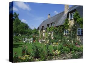 Thatched Cottages in the Cotswolds, Gloucestershire, England, UK-Rainford Roy-Stretched Canvas