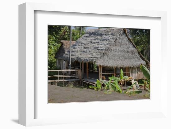 Thatched Roof Home Made of Leaves in the Peruvian Town of Amazonas-Mallorie Ostrowitz-Framed Photographic Print