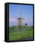 Thatched Windmills on the Canal at Kinderdijk, UNESCO World Heritage Site, Holland, Europe-Rainford Roy-Framed Stretched Canvas