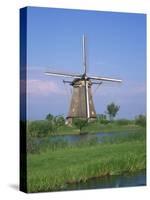 Thatched Windmills on the Canal at Kinderdijk, UNESCO World Heritage Site, Holland, Europe-Rainford Roy-Stretched Canvas