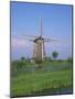Thatched Windmills on the Canal at Kinderdijk, UNESCO World Heritage Site, Holland, Europe-Rainford Roy-Mounted Photographic Print