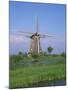 Thatched Windmills on the Canal at Kinderdijk, UNESCO World Heritage Site, Holland, Europe-Rainford Roy-Mounted Photographic Print