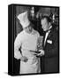 The 21 Club's Jack Kriendler Wearing a Tuxedo and Conferring with a Chef in the Club's Kitchen-null-Framed Stretched Canvas