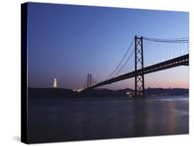 The 25 April Suspension Bridge at Dusk over the River Tagus (Rio Tejo), Christus Rei Is Illuminated-Stuart Forster-Stretched Canvas