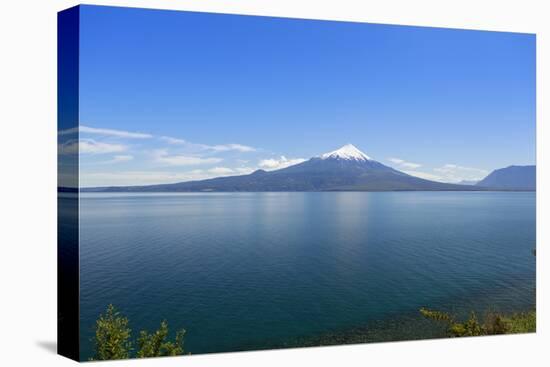 The 2652 metre tall Osorno Volcano, a conical stratovolcano, in northern Patagonia near Puerto Mont-Alex Robinson-Stretched Canvas