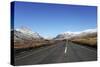 The A5 Road Runs Through Past Snow-Capped Mountains in Snowdonia National Park-Stuart Forster-Stretched Canvas