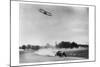 The Airplane Races the Automobile-null-Mounted Art Print