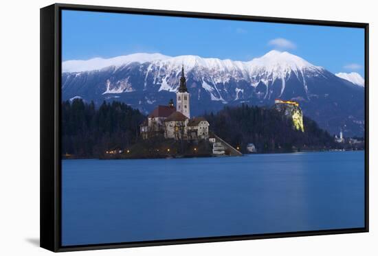 The Assumption of Mary Pilgrimage Church on Lake Bled and Bled Castle at Dusk, Bled, Slovenia-Miles Ertman-Framed Stretched Canvas