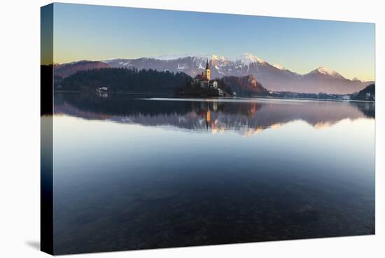 The Assumption of Mary Pilgrimage Church on Lake Bled and Bled Castle, Bled, Slovenia, Europe-Miles Ertman-Stretched Canvas