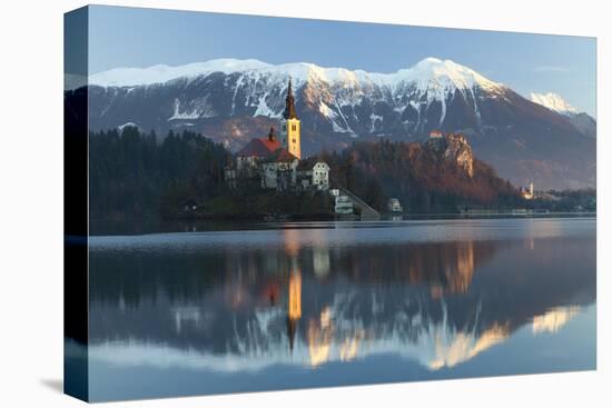 The Assumption of Mary Pilgrimage Church on Lake Bled and Bled Castle, Bled, Slovenia, Europe-Miles Ertman-Stretched Canvas