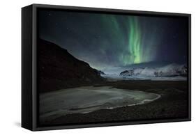 The Aurora Borealis over a Glacier in the Skaftafell National Park in Iceland-Alex Saberi-Framed Stretched Canvas