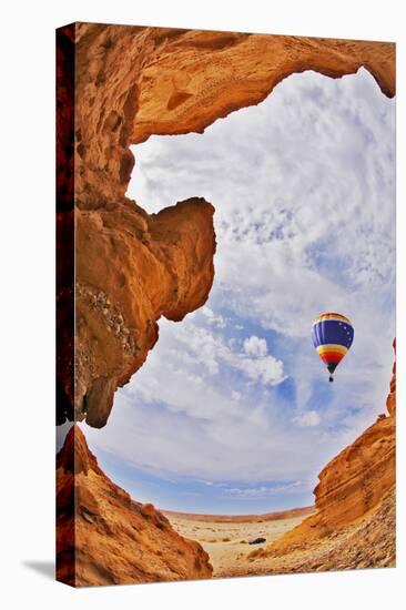 The Balloon Flies above a Picturesque Slot-Hole Canyon in Desert-kavram-Stretched Canvas