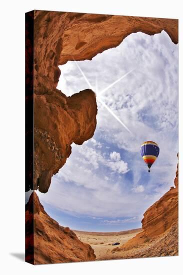 The Balloon Flies above a Picturesque Slot-Hole Canyon in Desert-kavram-Stretched Canvas