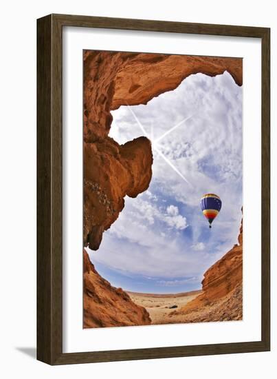 The Balloon Flies above a Picturesque Slot-Hole Canyon in Desert-kavram-Framed Photographic Print