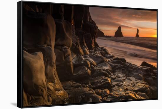 The basalt rock formations in the sea on Reynisfjara Beach in Vik, Iceland at sunrise.-Alex Saberi-Framed Stretched Canvas