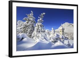 The bell tower submerged by snow surrounded by woods Maloja Canton of Engadine Switzerland Europe-ClickAlps-Framed Photographic Print