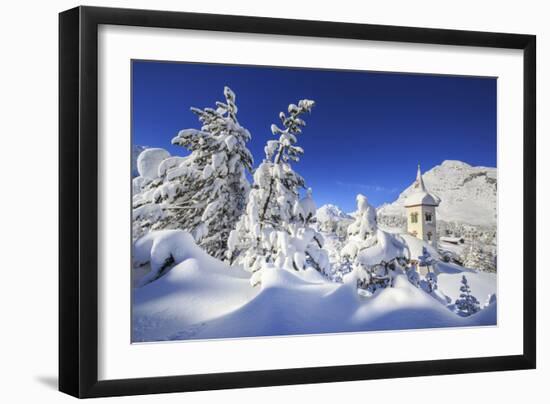 The bell tower submerged by snow surrounded by woods Maloja Canton of Engadine Switzerland Europe-ClickAlps-Framed Photographic Print