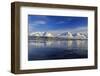 The blue sky and snow capped mountains are reflected in the frozen water  Breivikeidet Lyngen Alps -ClickAlps-Framed Photographic Print