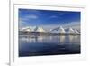 The blue sky and snow capped mountains are reflected in the frozen water  Breivikeidet Lyngen Alps -ClickAlps-Framed Photographic Print