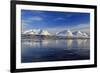 The blue sky and snow capped mountains are reflected in the frozen water  Breivikeidet Lyngen Alps -ClickAlps-Framed Photographic Print