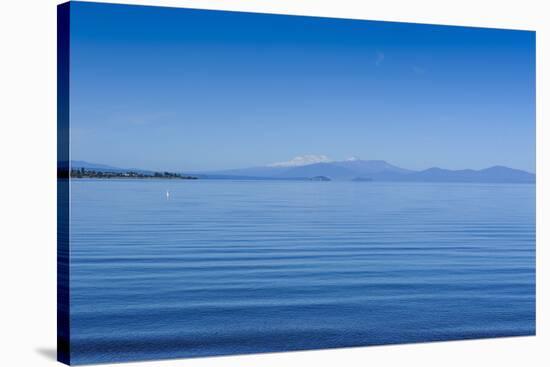 The Blue Waters of Lake Taupo with the Tongariro National Park in the Background-Michael-Stretched Canvas