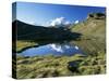 The Breithorn Reflected in Lake, White Chapel in Distance on Hillside, Zermatt, Valais, Switzerland-Ruth Tomlinson-Stretched Canvas